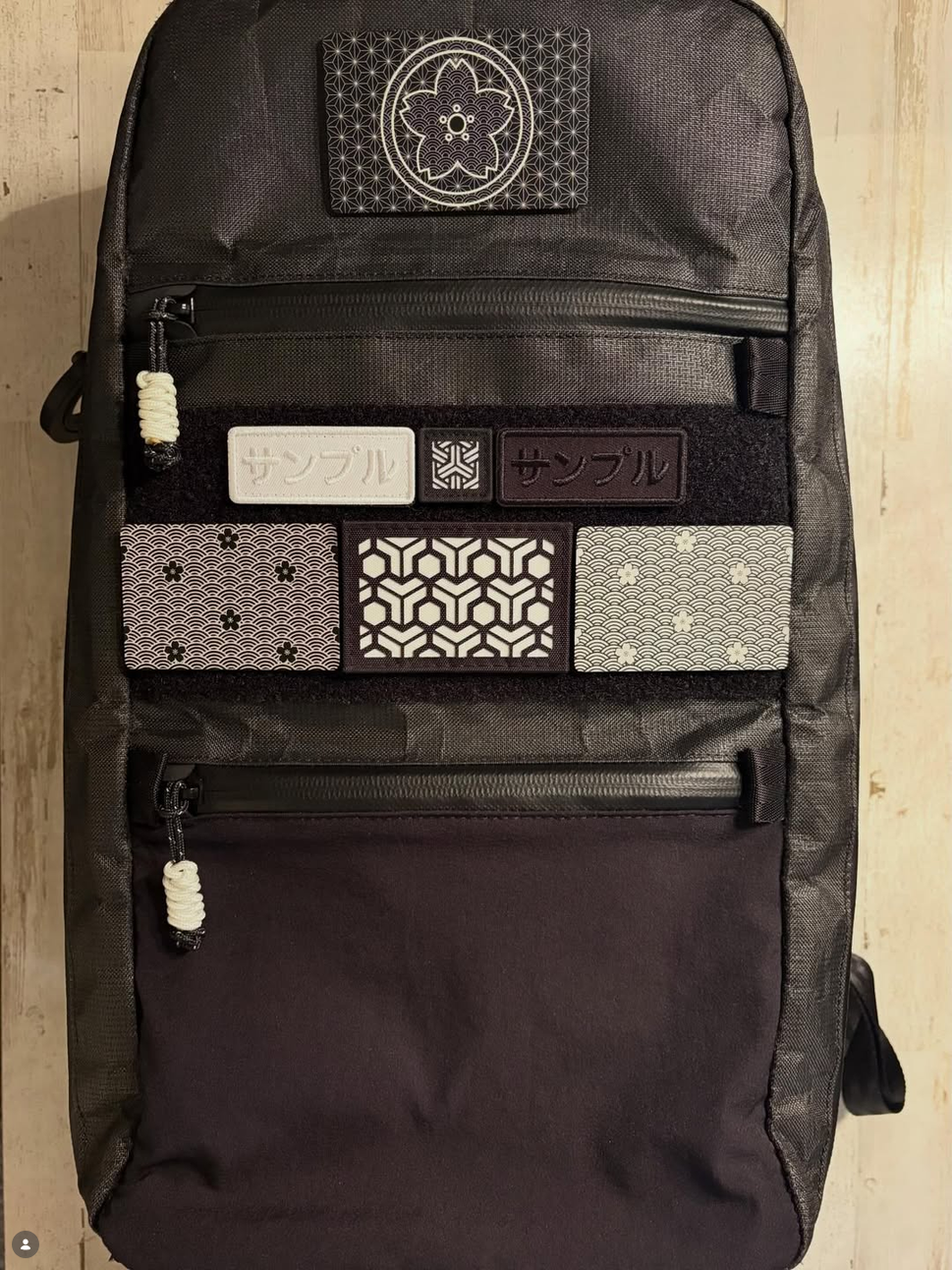 ELE Survival black backpack with paracord zipper pulls